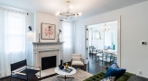 living room with fireplace seating and view of a dining room