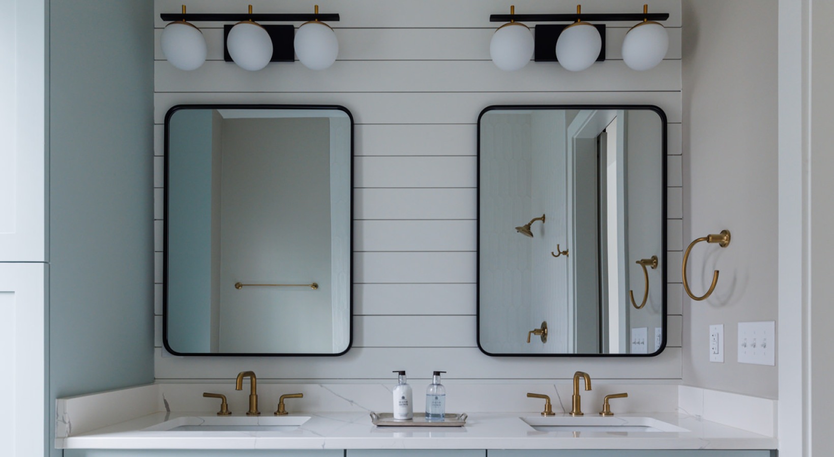 a bathroom with blue cabinets