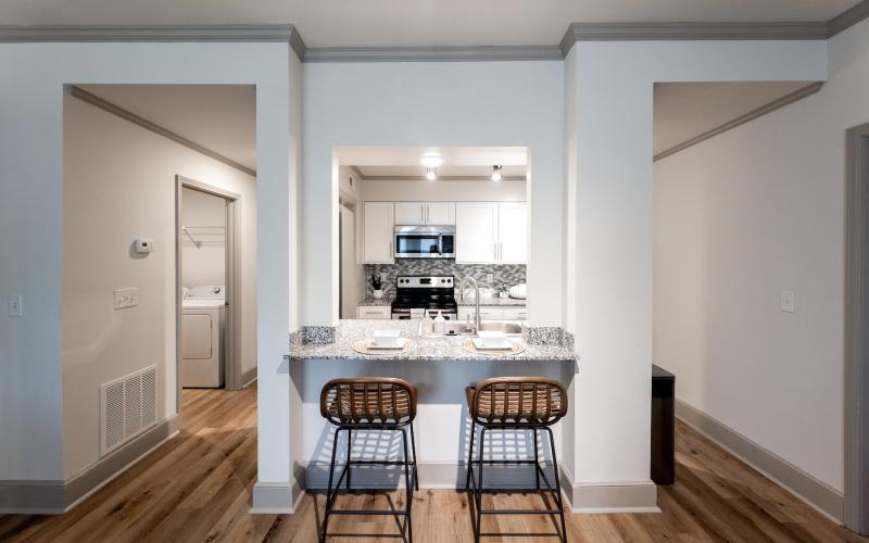 a kitchen with a table and chairs