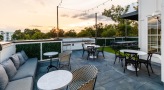 a patio with tables and chairs