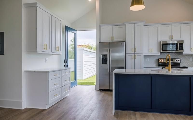 a kitchen with white cabinets