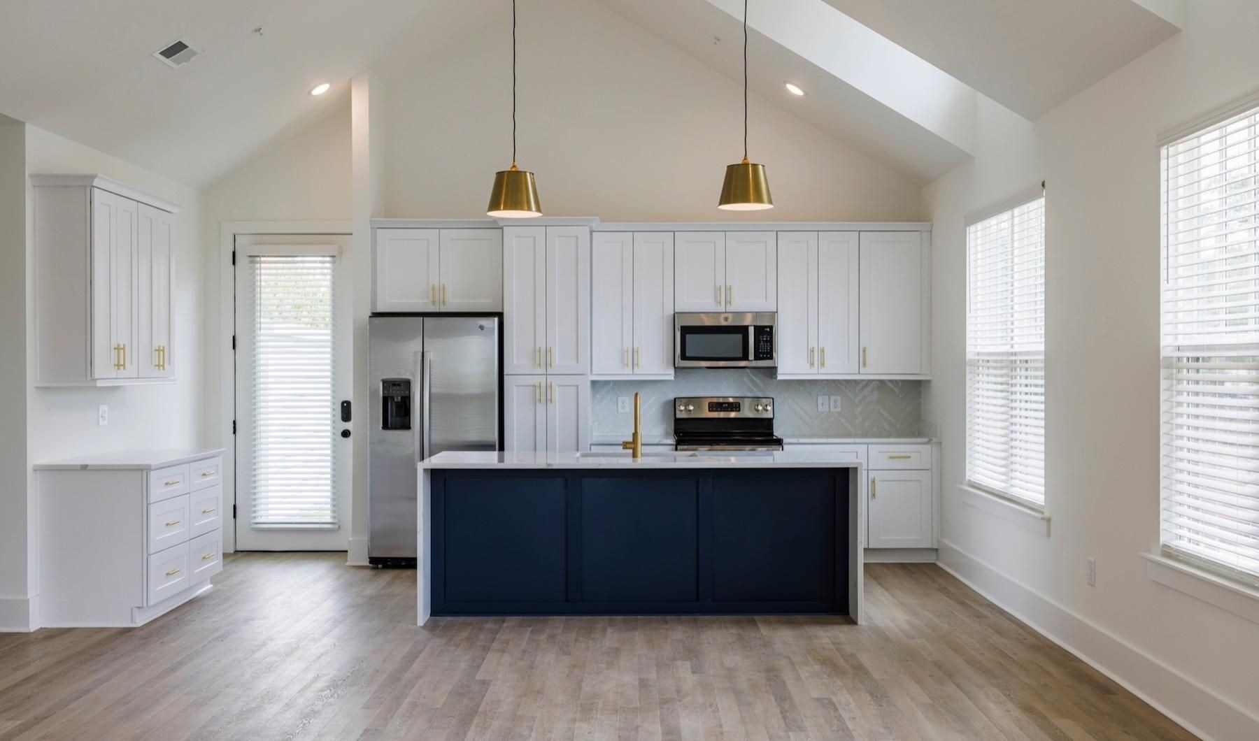 a kitchen with white cabinets