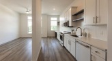 a kitchen with white cabinets