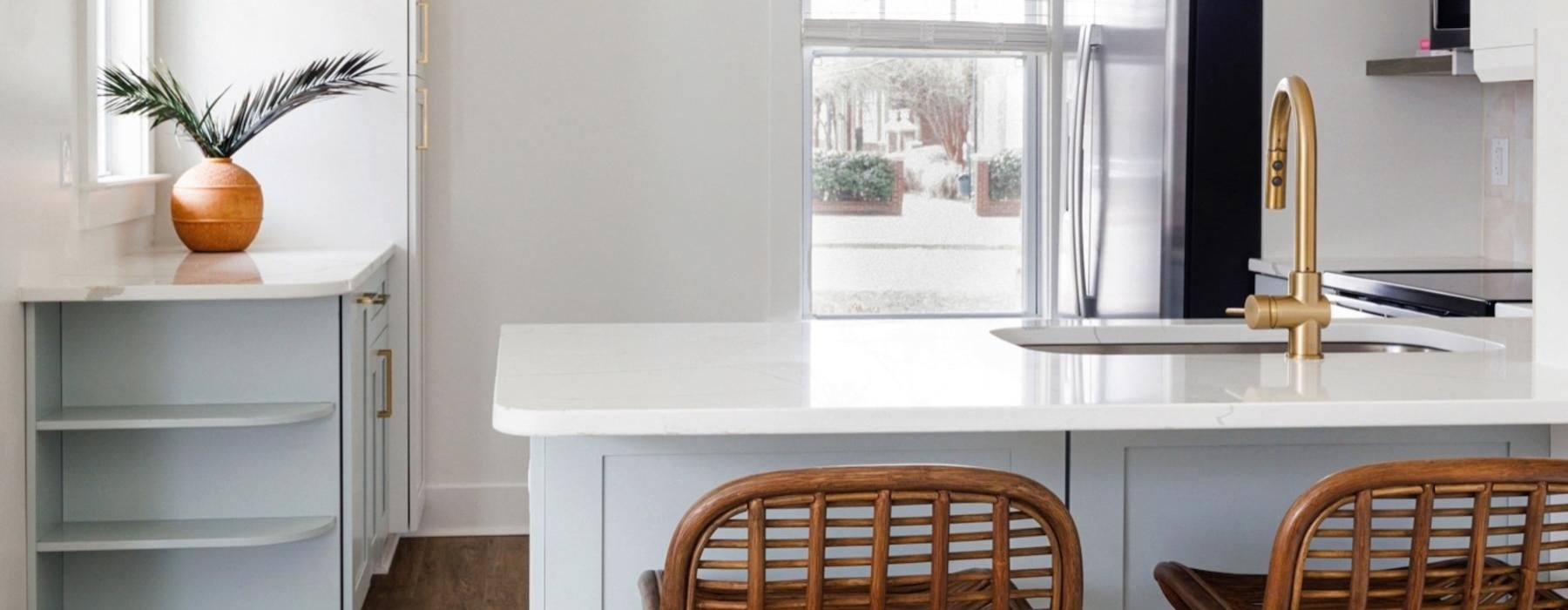 a kitchen with a table and chairs