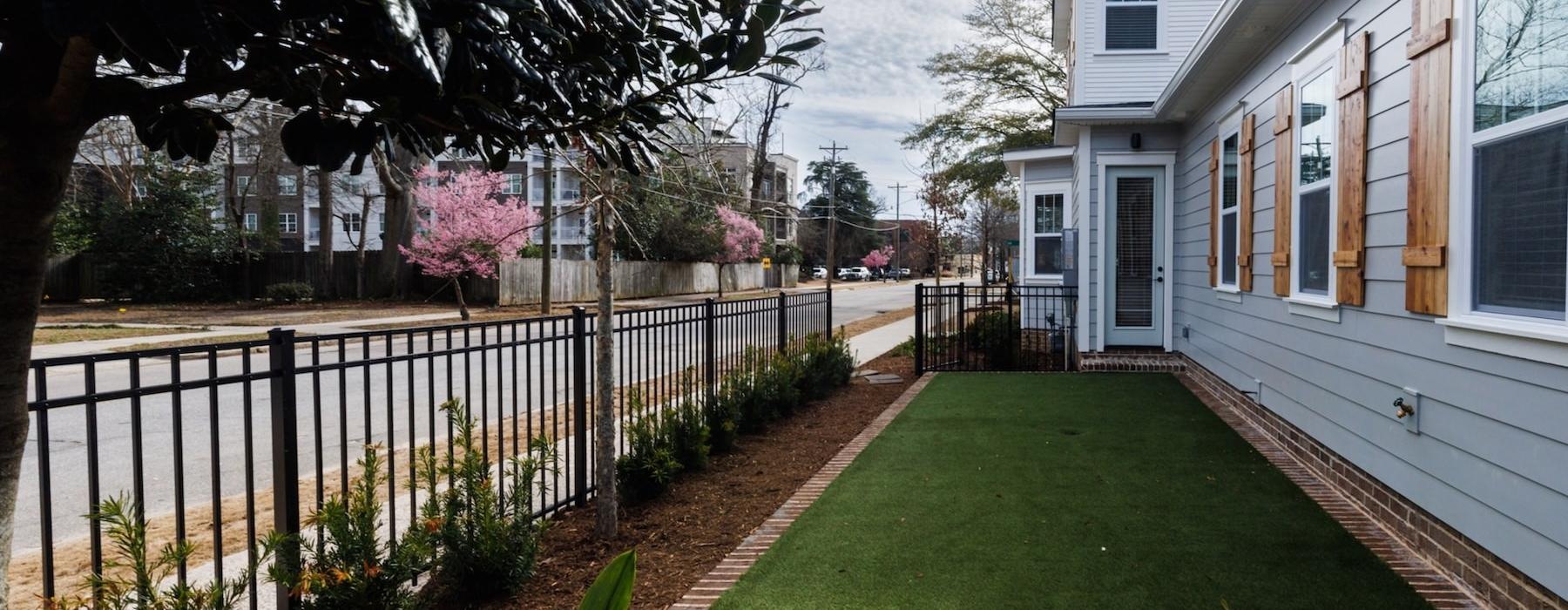a small yard next to a house