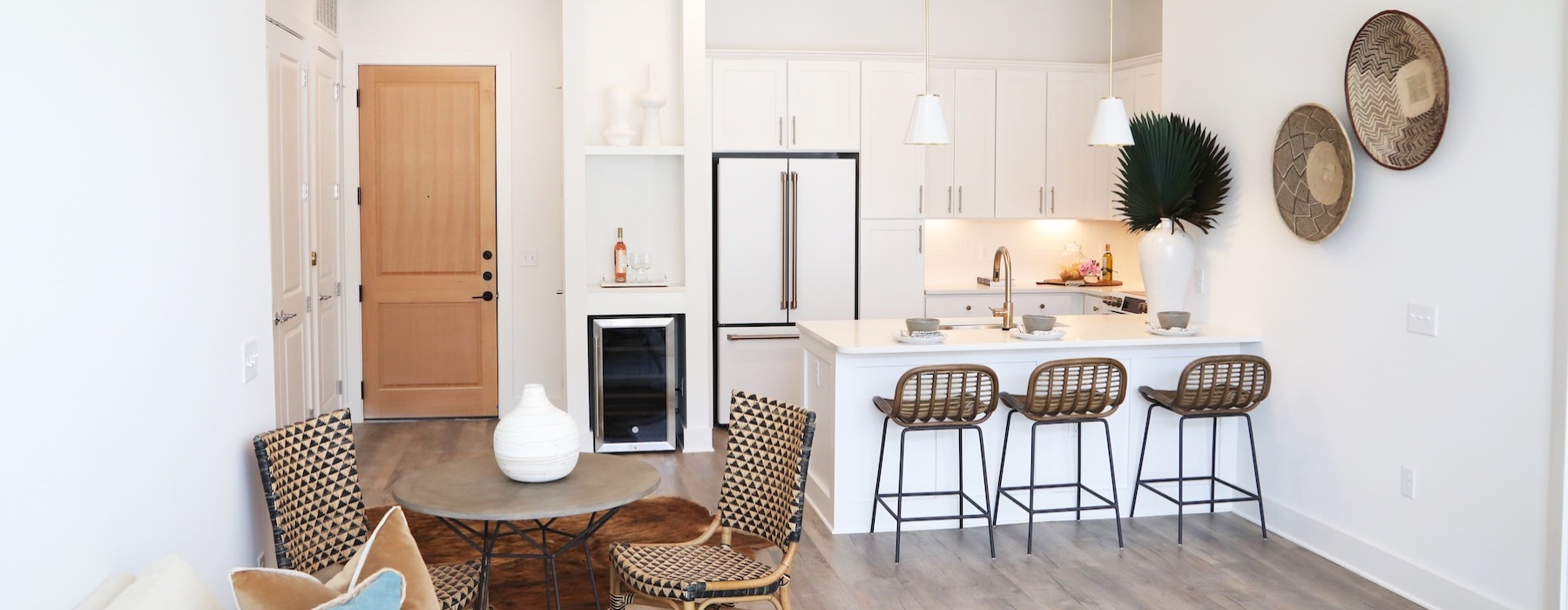 living room and kitchen with barstools