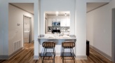 a kitchen with a table and chairs