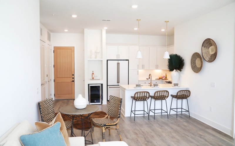 living room with dining room table seating and kitchen
