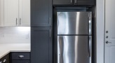 a black refrigerator in a kitchen